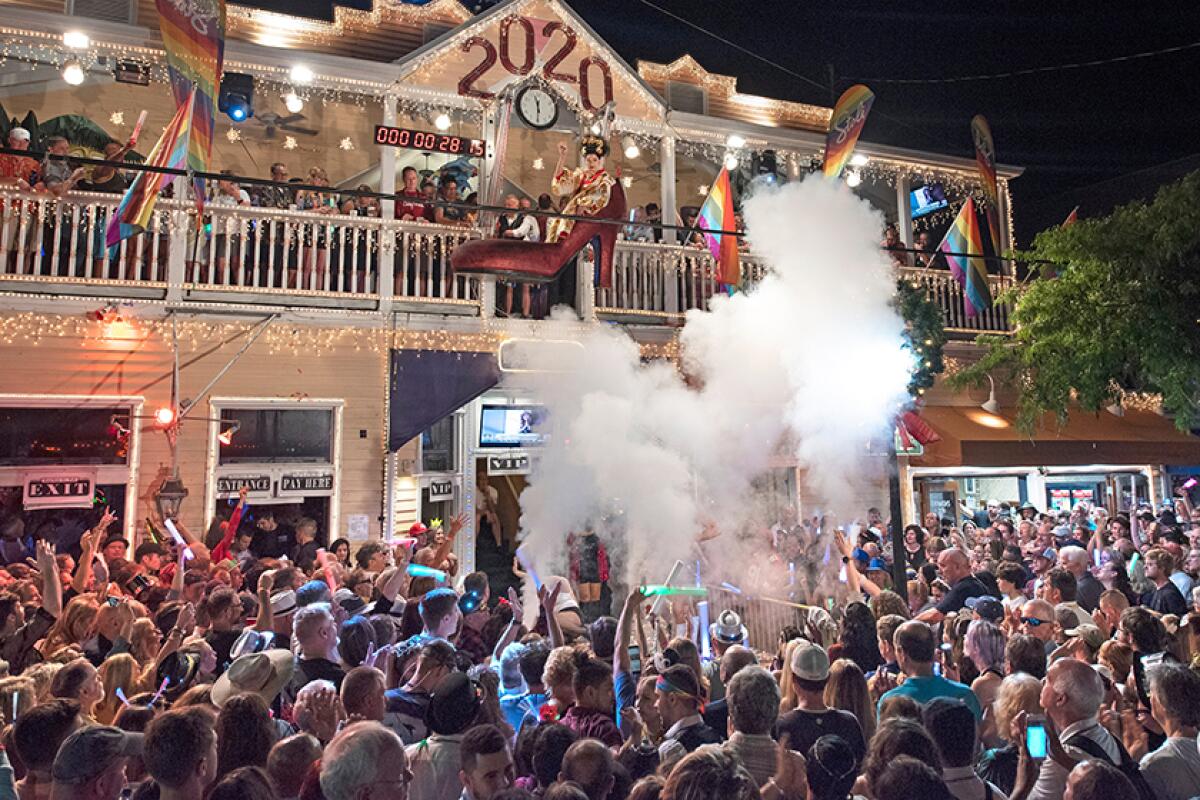 Gary Marion, known as the drag queen Sushi, is suspended in a huge facsimile of a woman’s high heel in Key West, Fla. Sushi was lowered during the countdown to 2020.