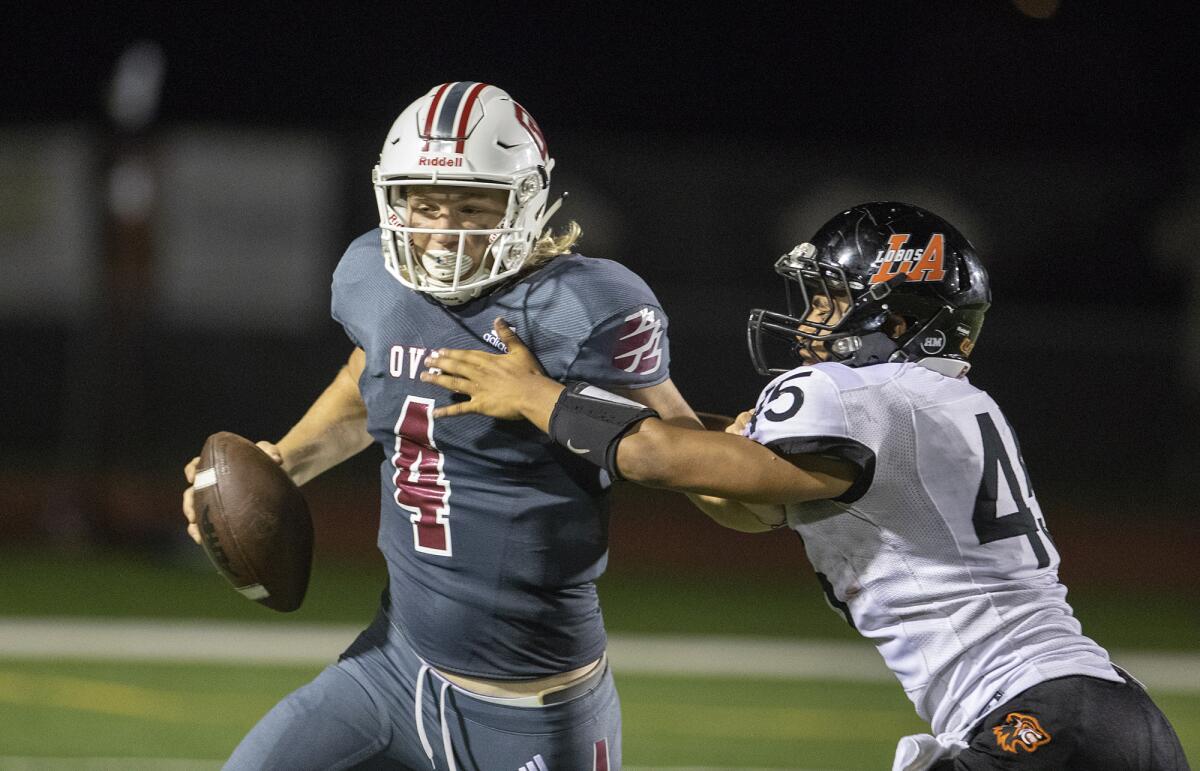 Ocean View quarterback Braden Crabtree (4), shown getting forced out by Los Amigos' Carlos Vargas on Aug. 30, led the Seahawks to a 41-13 win at Westminster on Friday.