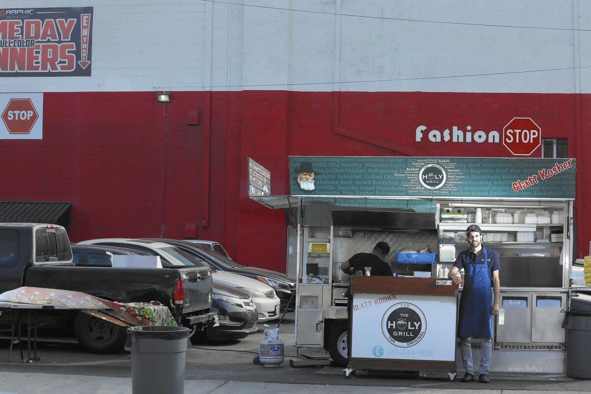 The Holy Grill food truck is on 15th Street in Los Angeles' downtown garment district.