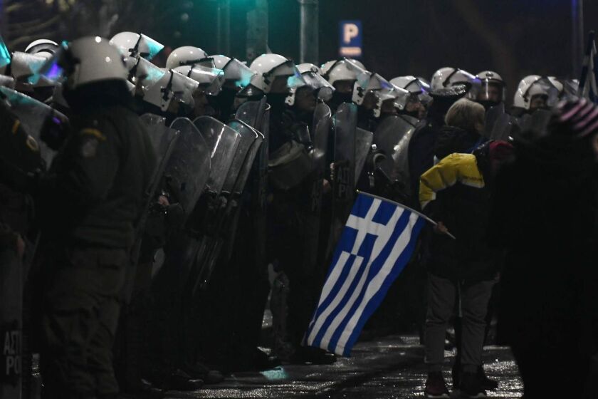 Demonstrators face Greek riot police as they demonstrate on December 14, 2018 in Thessaloniki to protest over the country's name deal with Macedonia. - Macedonia's name is a sensitive issue for Athens since a northern region of Greece has the same designation. The former Yugoslav republic held a referendum in September in which it voted to change its name to North Macedonia, after decades of discussions. (Photo by Sakis MITROLIDIS / AFP)SAKIS MITROLIDIS/AFP/Getty Images ** OUTS - ELSENT, FPG, CM - OUTS * NM, PH, VA if sourced by CT, LA or MoD **