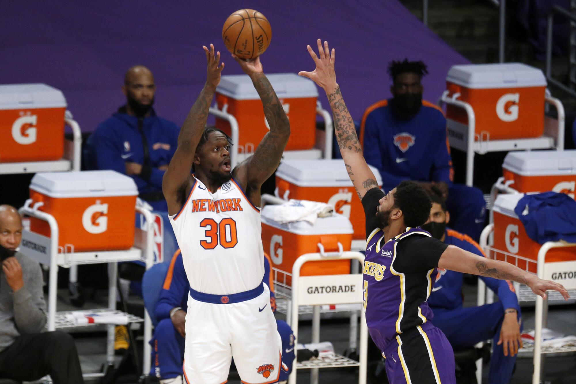 Knicks forward Julius Randle takes a shot over Lakers forward Anthony Davis.
