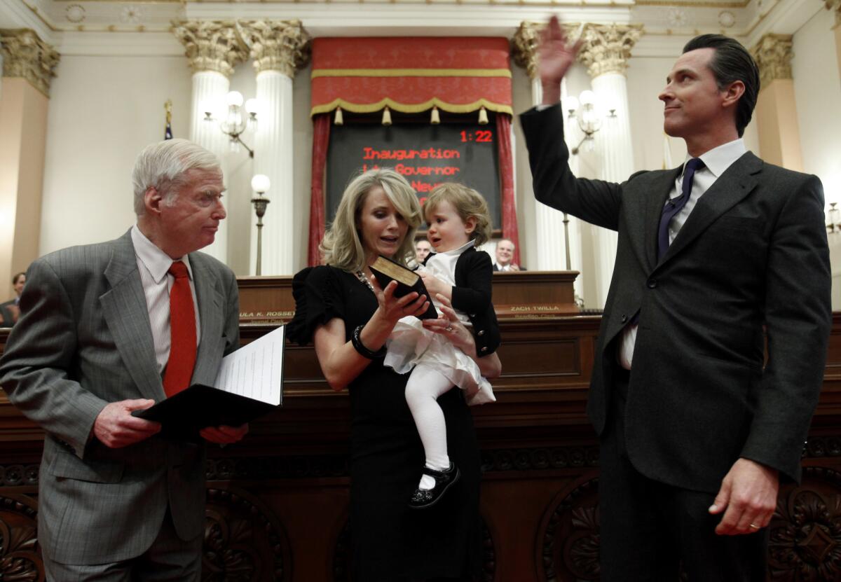 Gavin Newsom, right, was sworn in as lieutenant governor in 2011 by his father, William Newsom.