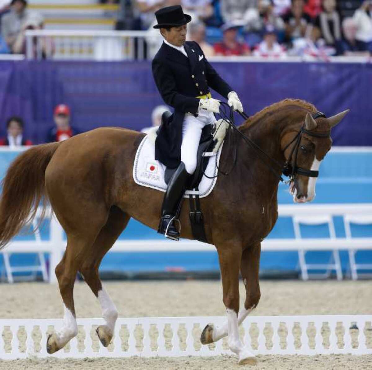 Hiroshi Hoketsu from Japan rides Whisper in the equestrian dressage competition.