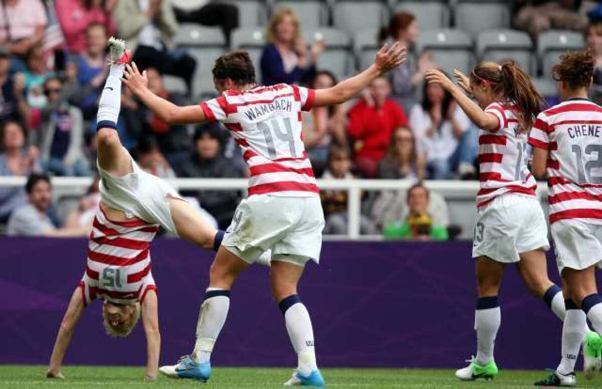 The U.S. team prepares to somersault after scoring against New Zealand on Friday.
