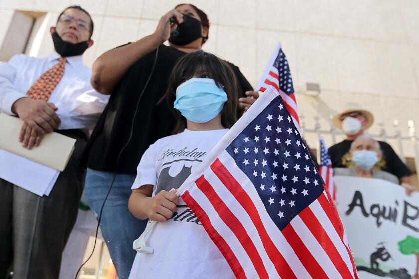Immigrant advocates demonstrate outside a federal detention center in Los Angeles last year.