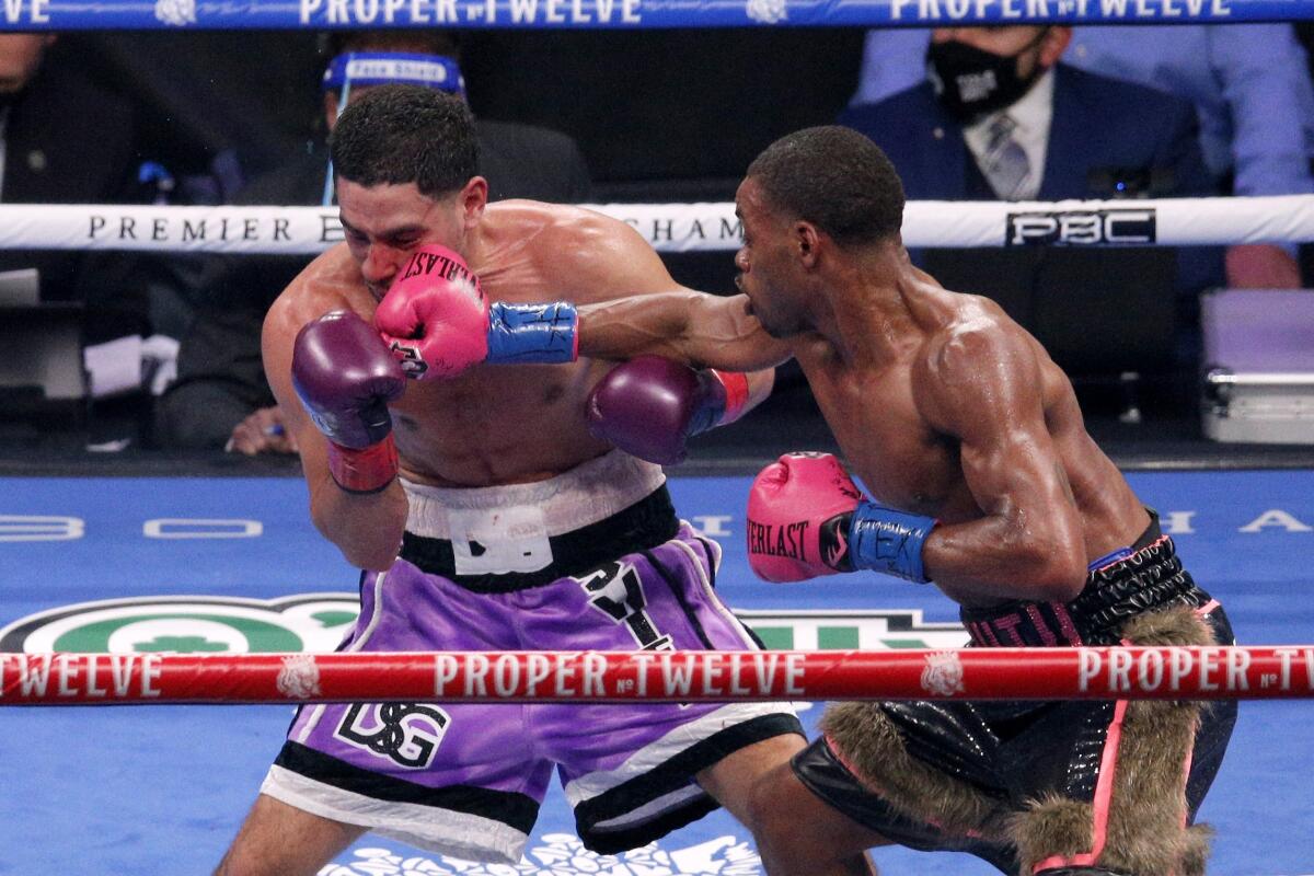 Errol Spence Jr. connects with a right to the head of Danny Garcia.