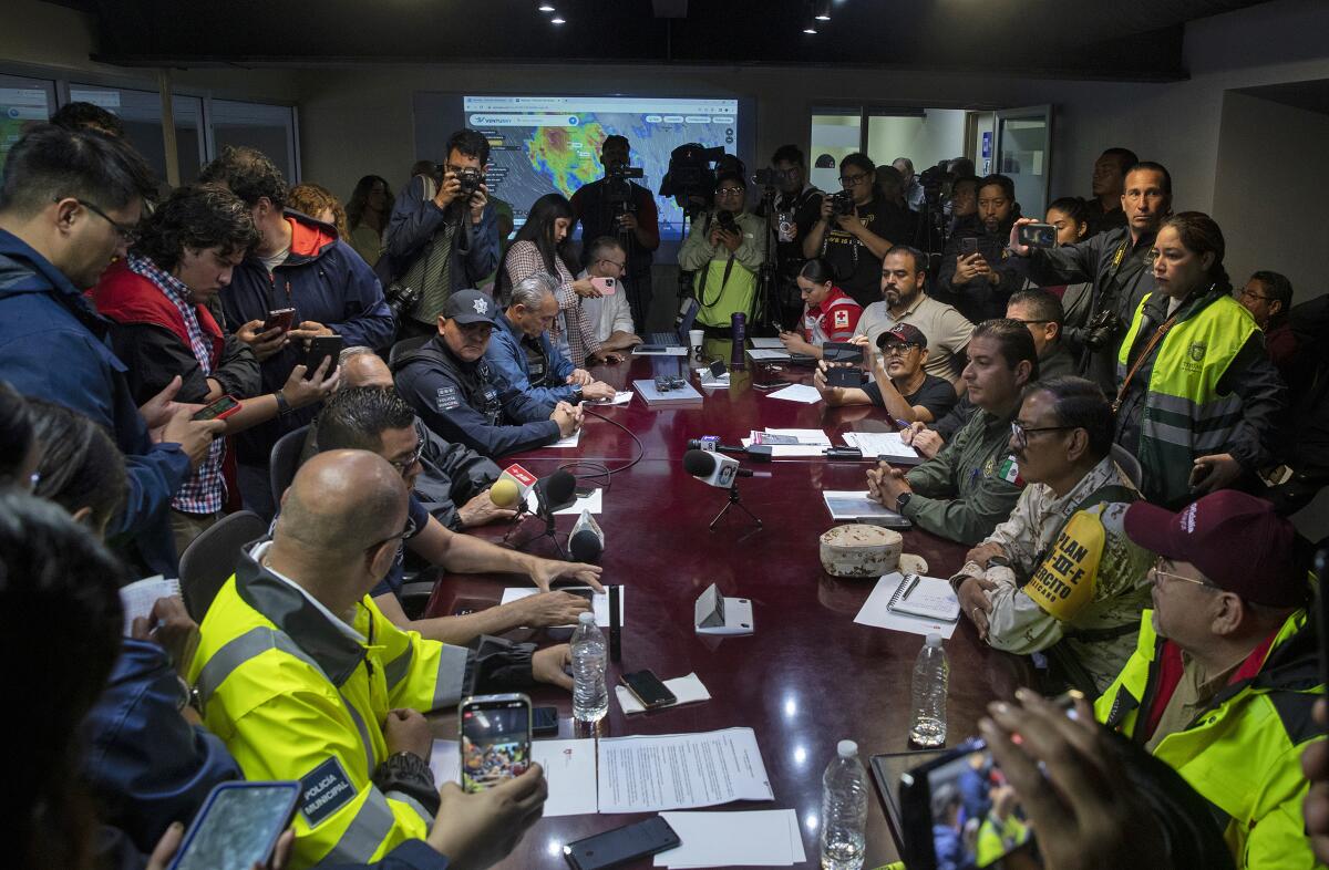 A briefing is given during an emergency meeting with Tijuana city officials