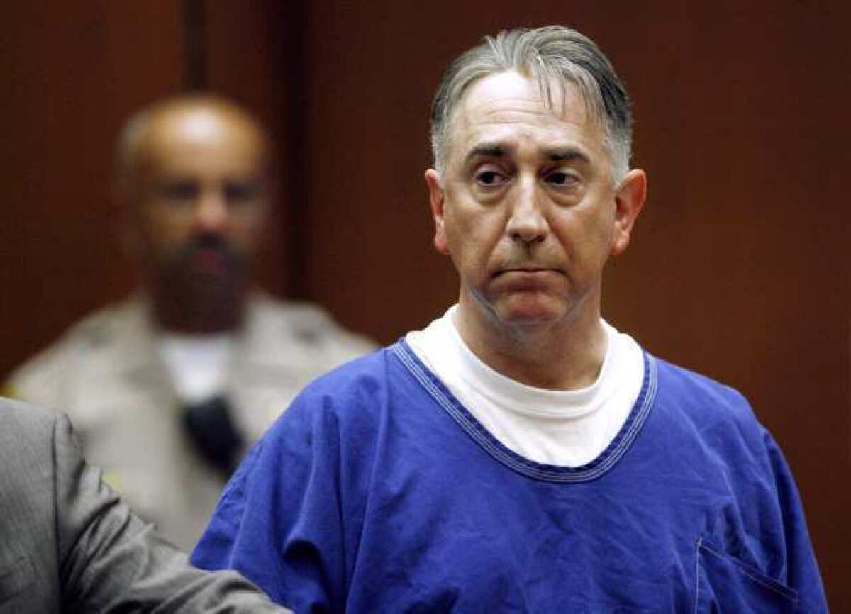 Former Glendale City Councilman John Drayman looks over to the District Attorney's side as he appears before a judge at the C.S. Foltz Criminal Justice Center for a bail hearing in Los Angeles. Drayman's friends paid the bail for his release.