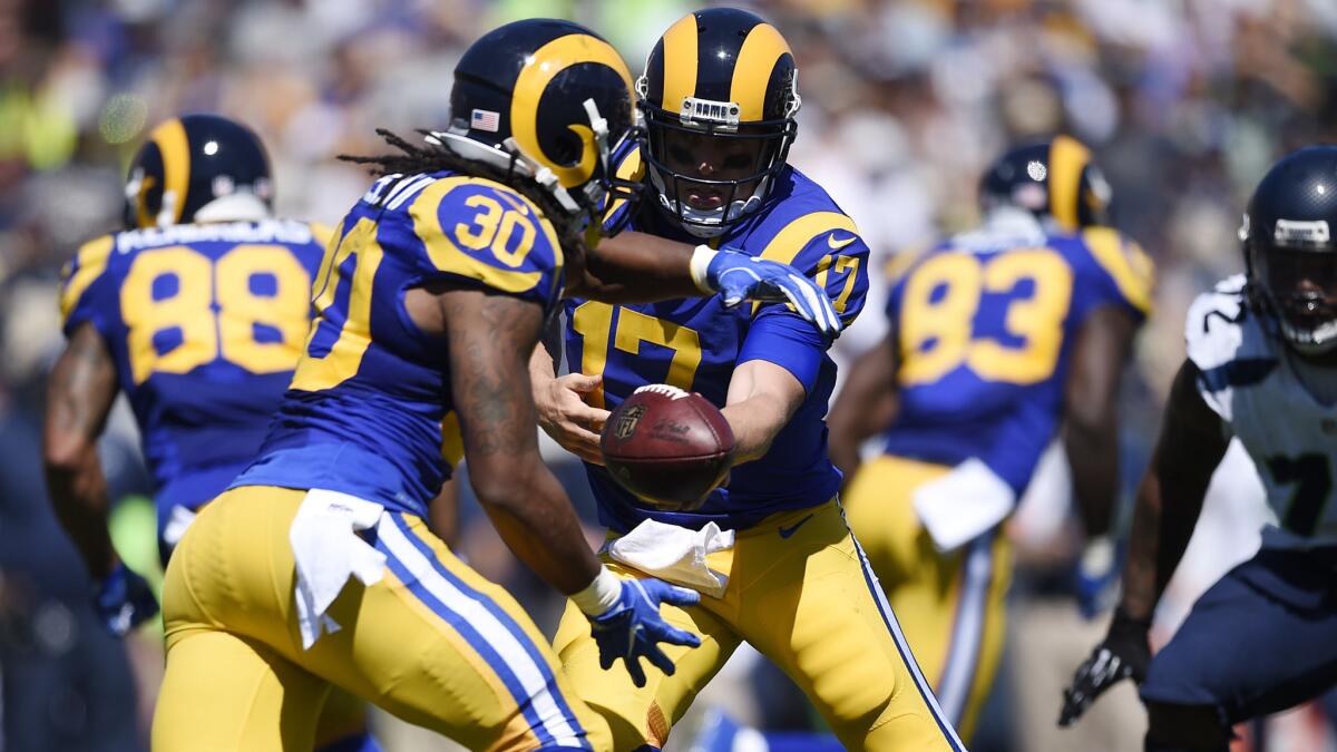 Rams quarterback Case Keenum hands off to running back Todd Gurley during the home opener against the Seahawks, a 9-3 win on Sunday.