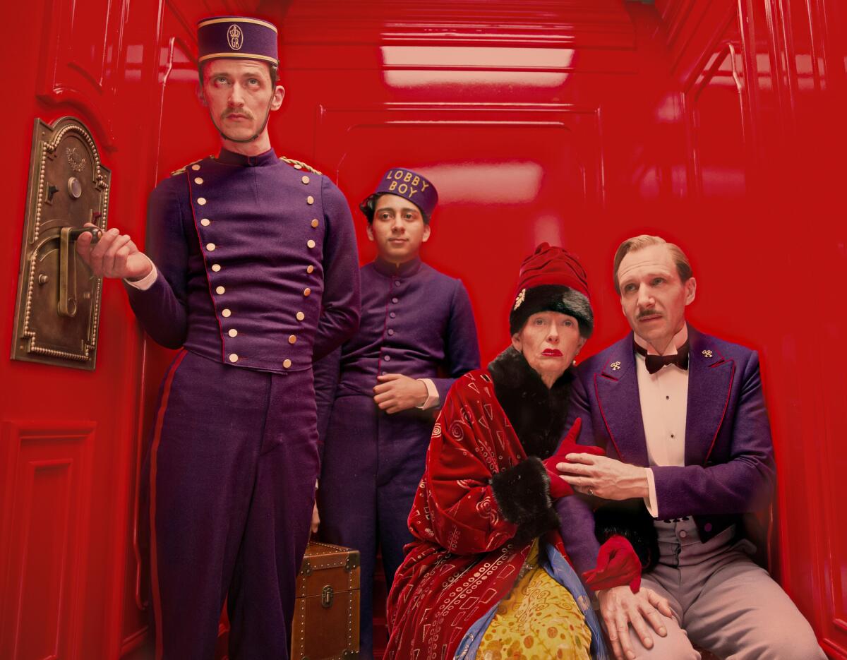 A scene from "The Grand Budapest Hotel" including, from left, Paul Schlase, Tony Revolori, Tilda Swinton and Ralph Fiennes. Wes Anderson's film is up for nine Academy Awards -- including nominations for costume design, and makeup and hairstyling.