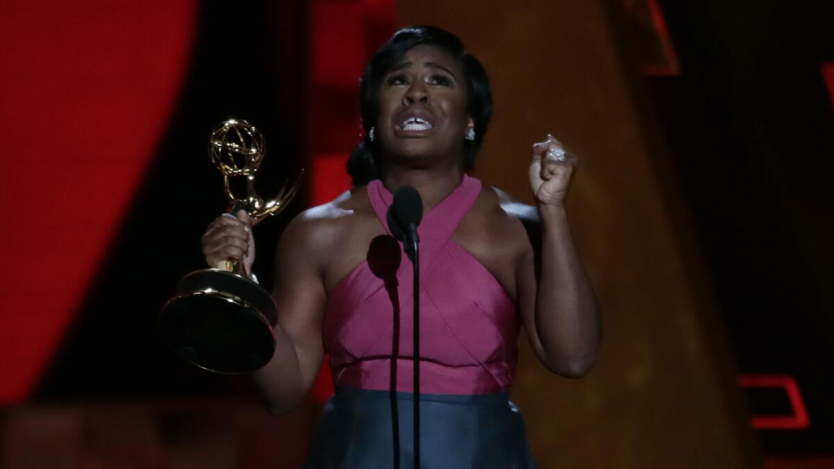 A very grateful and tearful Uzo Aduba accepts the award for supporting actress in a drama series for her role on "Orange Is the New Black."
