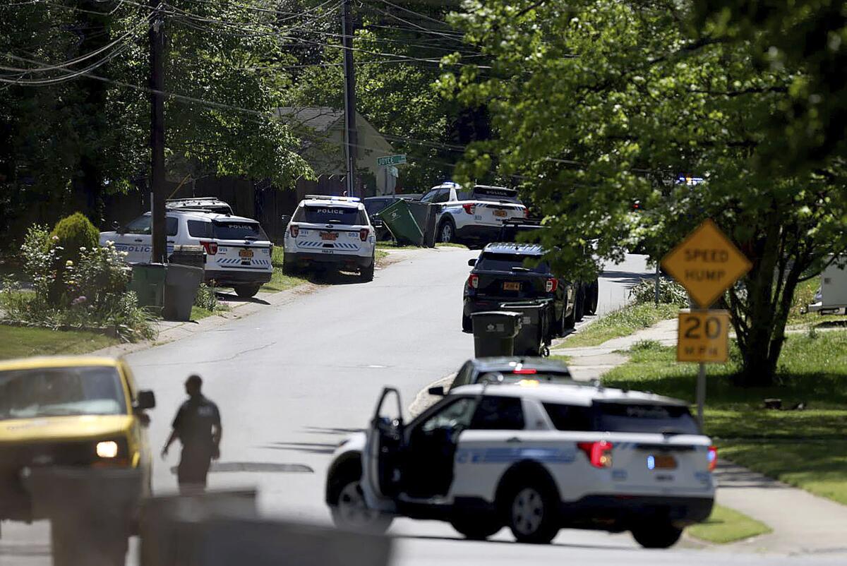 Police work at the scene of a shooting in east Charlotte, N.C. 
