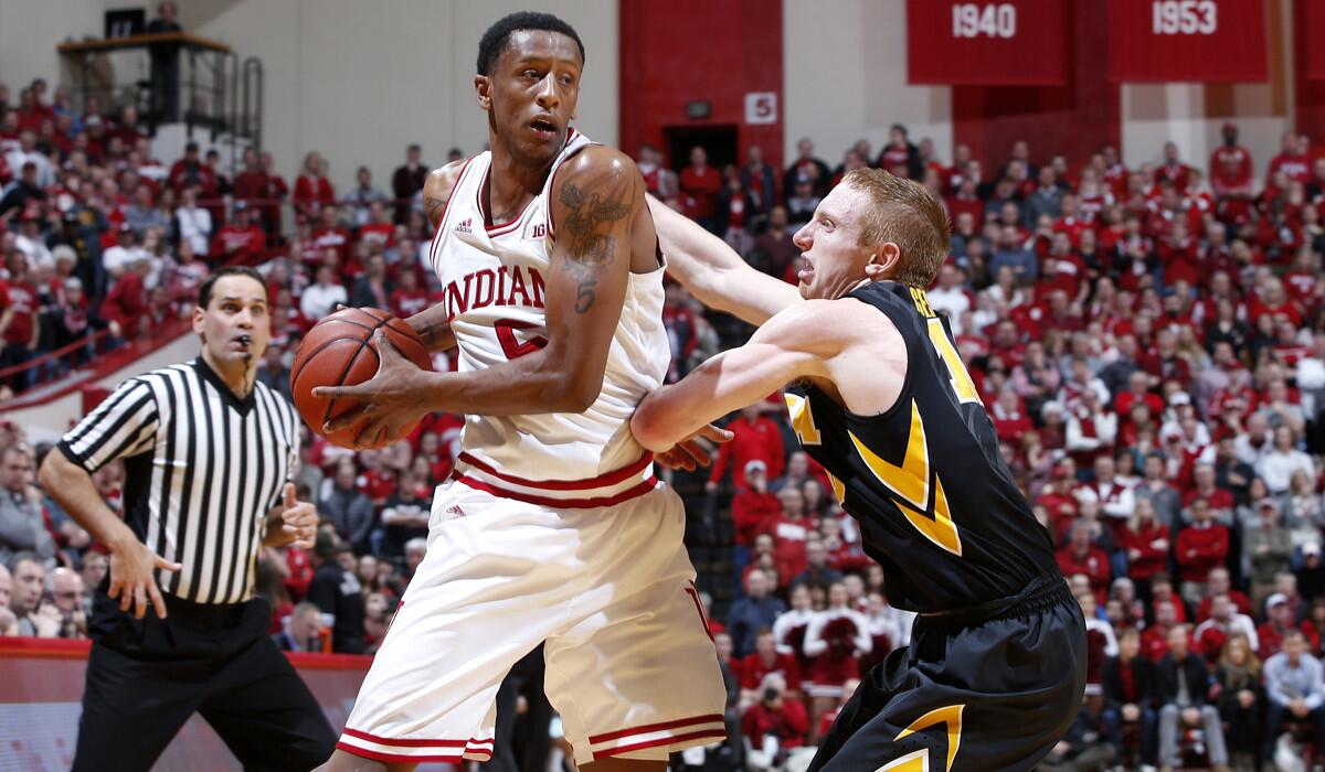 Iowa's Mike Gesell, right, defends against Indiana's Troy Williams in the second half on Thursday.