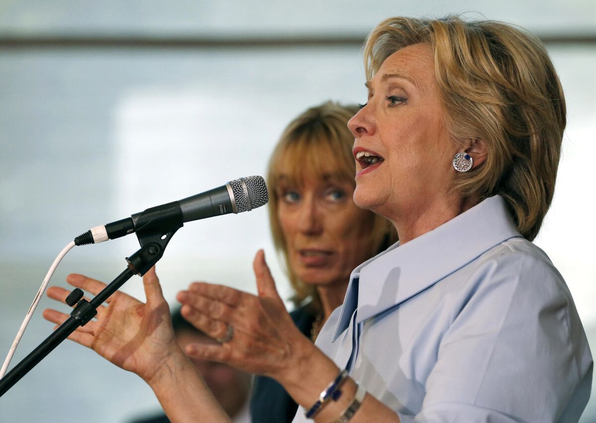 Democratic presidential candidate Hillary Rodham Clinton, accompanied by New Hampshire Gov. Maggie Hassan, speaks to an overflow crowd during a campaign stop at the University of New Hampshire, Friday, Sept. 18, 2015, in Durham, N.H. (AP Photo/Jim Cole)