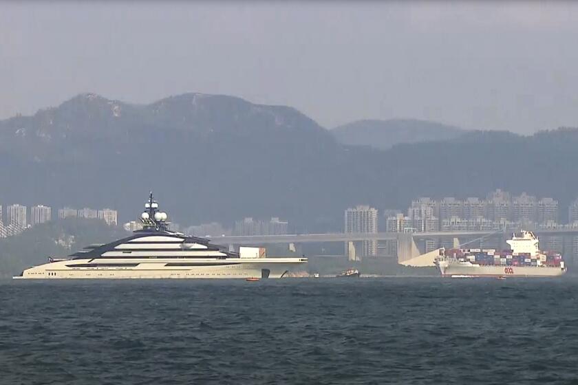 FILE - In this image taken from video footage run by TVB, the megayacht Nord, left, worth over $500 million, is seen off Hong Kong Island outside Victoria Harbour on Oct. 7, 2022. The U.S. has warned Hong Kong in a statement Monday, Oct. 10, 2022 that its status as a financial center could be affected if it acts as a safe haven for sanctioned individuals, days after a luxury yacht connected to a sanctioned Russian tycoon docked in the city. (TVB via AP, File)