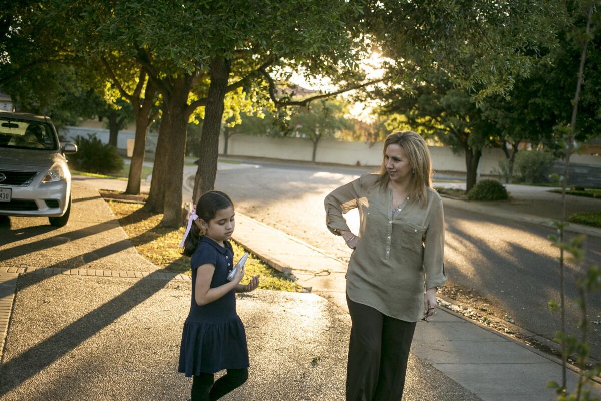 Patti Magnon, with daughter Allie, 7, in Laredo, Texas. The family hasn't visited Nuevo Laredo, Mexico, in years for fear of violence.
