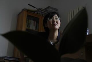 Activist Wang Yu, who found that her COVID-19 health app changed color and prevented her from traveling, speaks during an interview, Thursday, June 30, 2022, in Beijing. There was no evidence that she was sick or had been exposed to the virus. (AP Photo/Ng Han Guan)