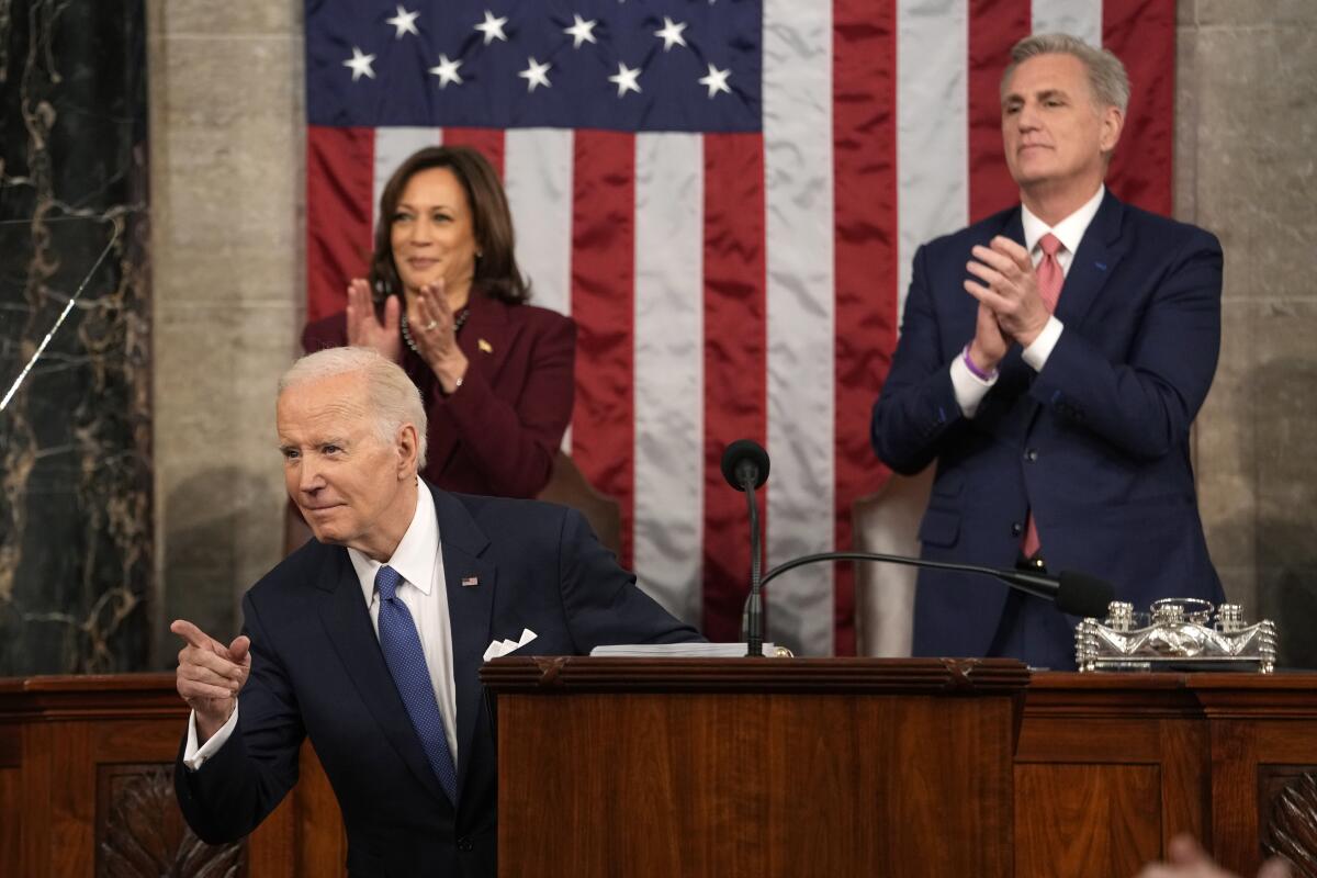 President Joe Biden gestures while speaking during a State of the Union address.
