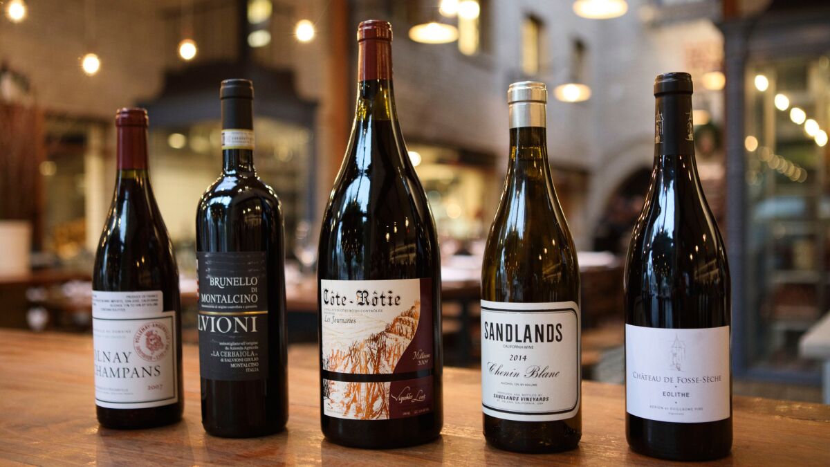 From left: 2007 Domaine Marquis d'Angerville Volnay Champans, 2008 Salvioni Cerbaiola Brunello di Montalcino from Italy, 2009 Vignobles Levet Cote-Rotie Les Journaries wine from France, Sandlands 2014 Chenin Blanc California and 2013 Chateau Fosse-Seche Saumur "Eolithe."