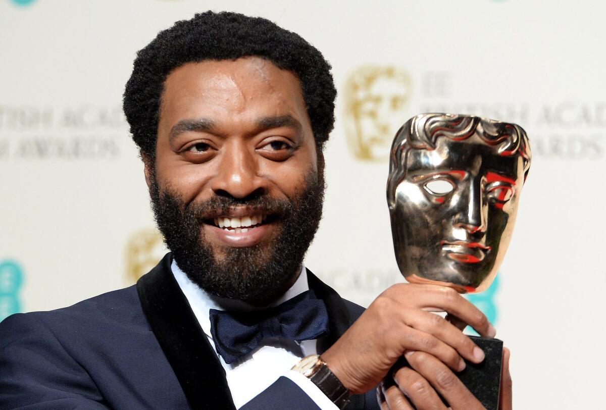 British actor Chiwetel Ejiofor poses in the press room after winning the lead actor award for his performance in "12 Years a Slave" at the 2014 BAFTA Awards in London.