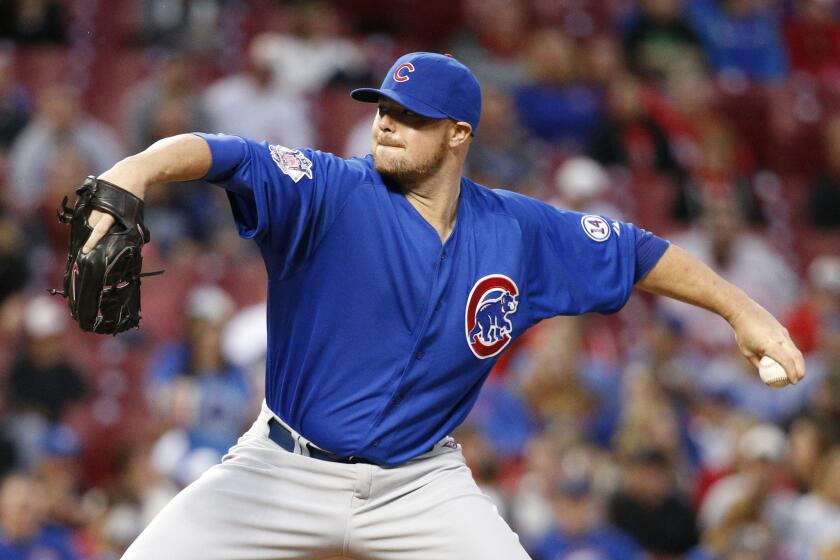 Cubs starting pitcher Jon Lester throws in the first inning.