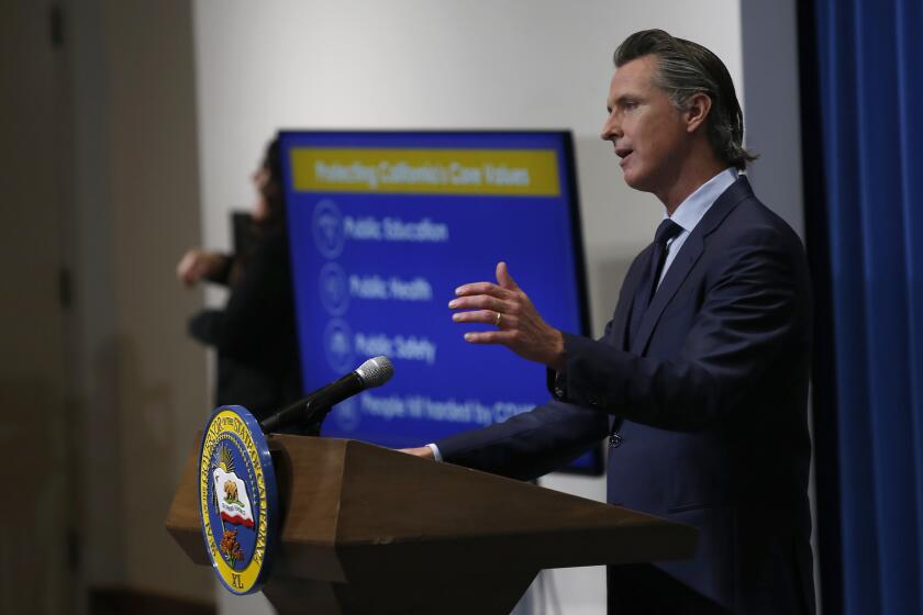California Gov. Gavin Newsom discusses his revised 2020-2021 state budget during a news conference in Sacramento, Calif., Thursday, May 14, 2020. Reflecting the financial hit California is already seeing from the coronavirus, Newsom proposed cutting $6.1 billion from a variety programs in a state budget he says prioritizes public education, public health and public safety. (AP Photo/Rich Pedroncelli, Pool)