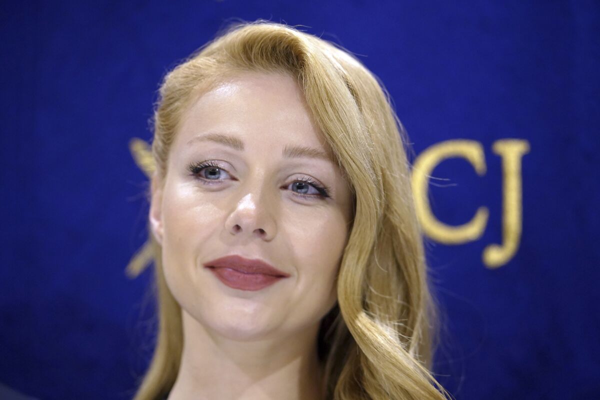 Tina Karol, Ukrainian singer and actress, poses prior to a press conference with Hiroshi Mikitani, CEO of Rakuten, Inc. and Sergiy Korsunsky, Ambassador of Ukraine to Japan, not in picture, at the Foreign Correspondents' Club of Japan, Monday, May 16, 2022, in Tokyo. (AP Photo/Eugene Hoshiko)