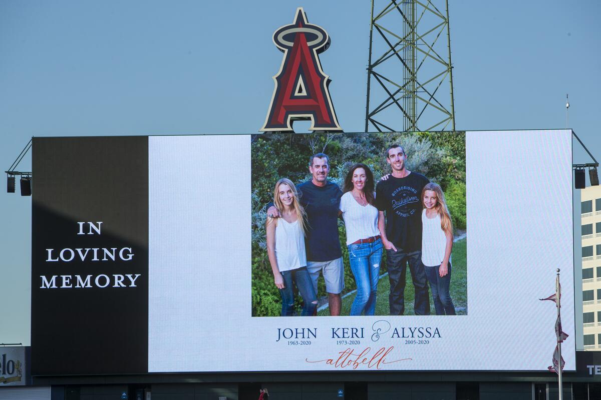 The Altobelli family, from left, Alexis, John, Keri, J.J. and Alyssa, is pictured on a video board at Angel Stadium in Anaheim during a memorial Feb. 10 for John, Keri and Alyssa, who were killed in a Jan. 26 helicopter crash along with Kobe and Gianna Bryant and four other people.
