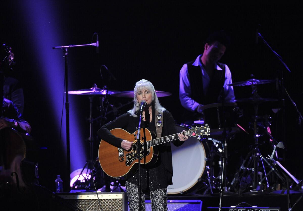 Emmylou Harris, shown during Friday's MusiCares tribute to Bruce Springsteen, led an all-star show Saturday at the Troubadour in West Hollywood.