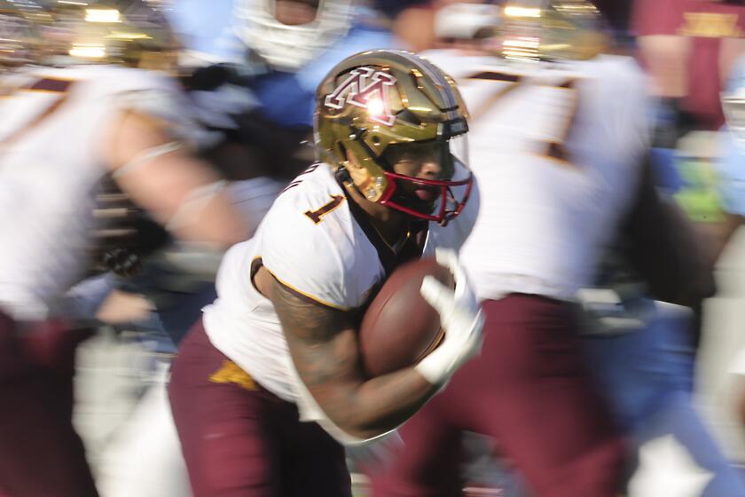 Minnesota running back Darius Taylor (1) runs the ball during the second half of an NCAA college football game against North Carolina, Saturday, Sept. 16, 2023, in Chapel Hill, N.C. (AP Photo/Reinhold Matay)