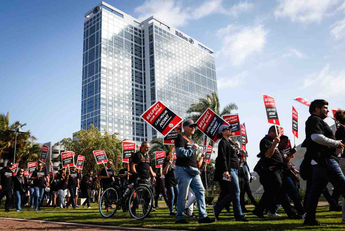Union workers march toward City Hall from San Diego Bayfront Park.