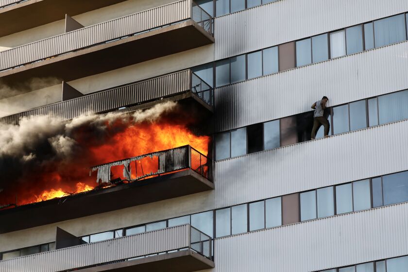 LOS ANGELES CA JANUARY 29, 2020 -- Firefighters on Wednesday are battling a large blaze that has enveloped the sixth floor of a 25-story residential building in Los Angeles, forcing residents to evacuate from the structure. (Al Seib / Los Angeles Times)