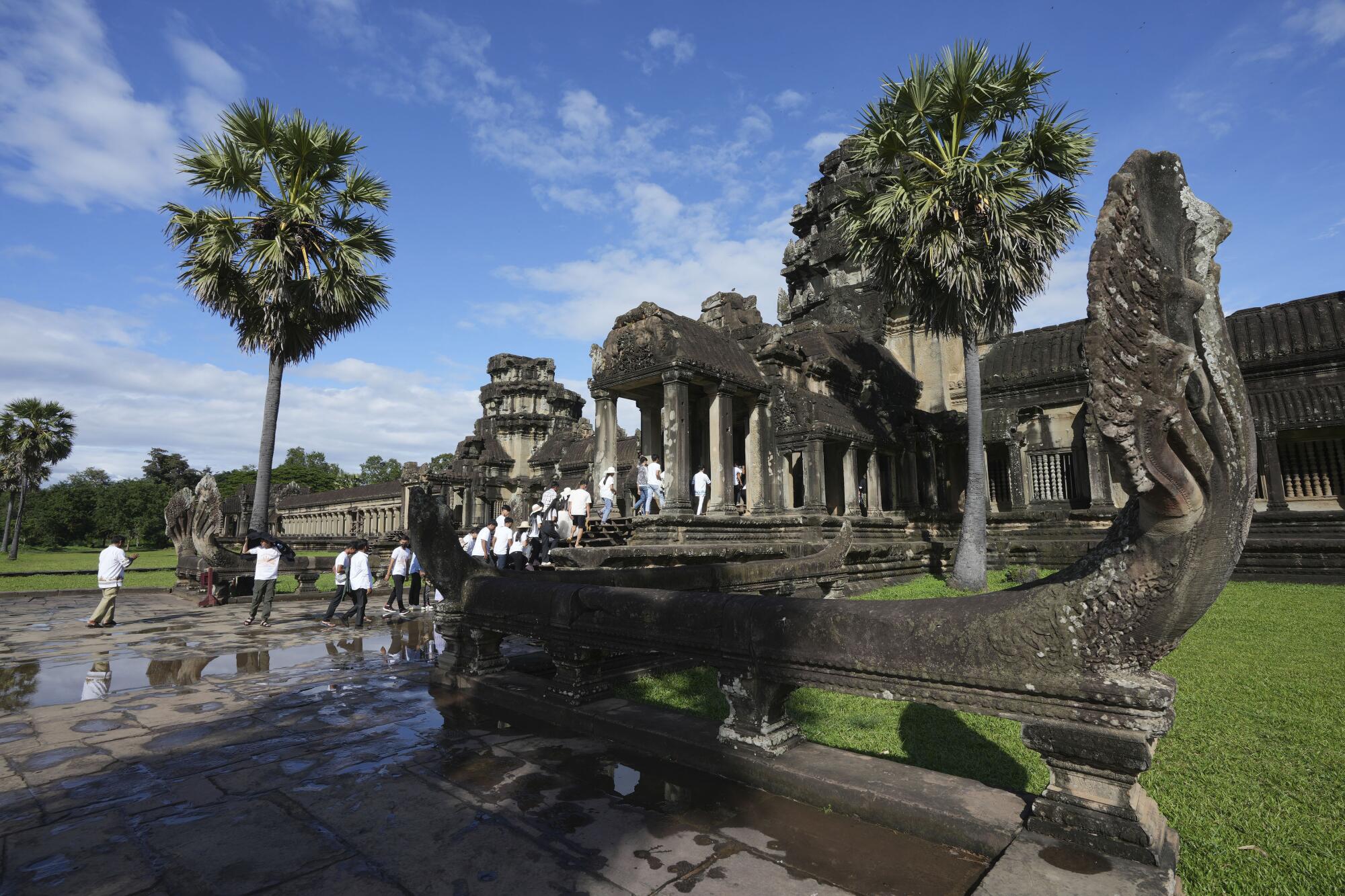 Tourists visit the Angkor Wat temple in Siem Reap, Cambodia, Wednesday, Nov. 2023