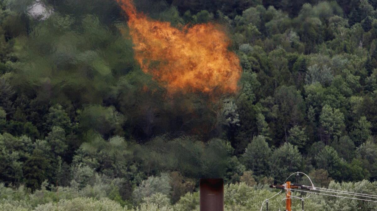 Methane burns at a landfill in Coventry, Vt., in 2005.