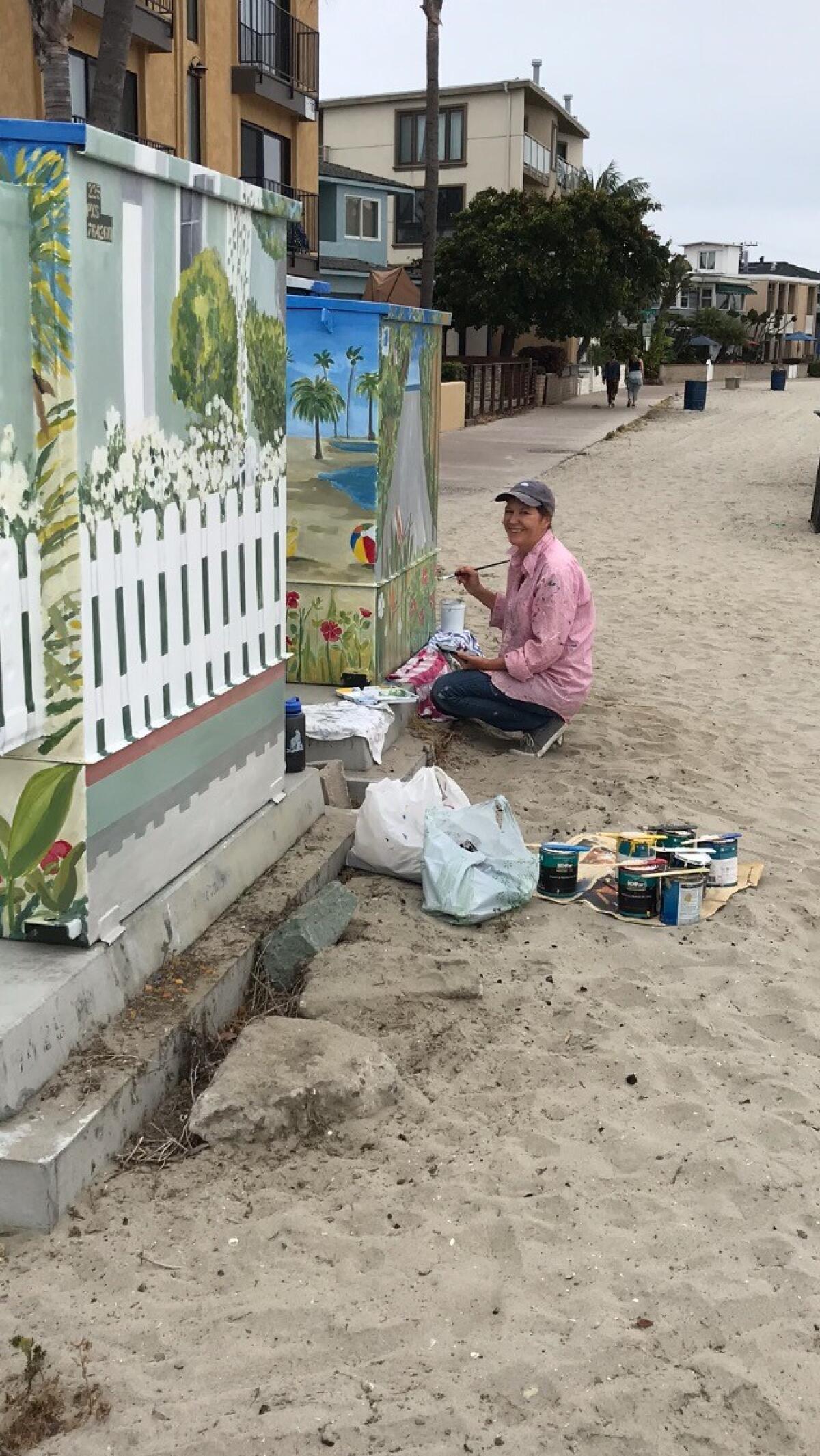 Utility box painter Tina Verburgt said she appreciates the thanks she gets from passersby when she is working.