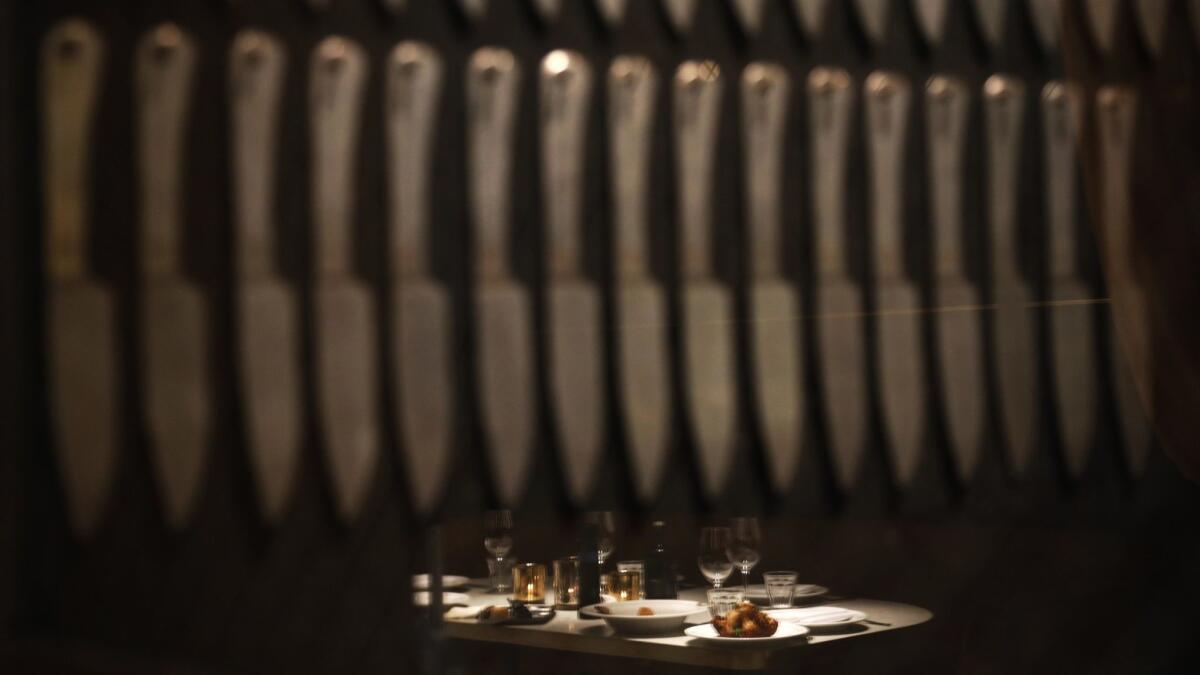 Rows of knives are on display for customers inside APL restaurant in Hollywood.