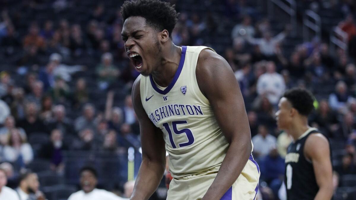 Washington's Noah Dickerson celebrates after a play against Colorado during the second half in the semifinals of the Pac-12 men's tournament on Friday in Las Vegas.