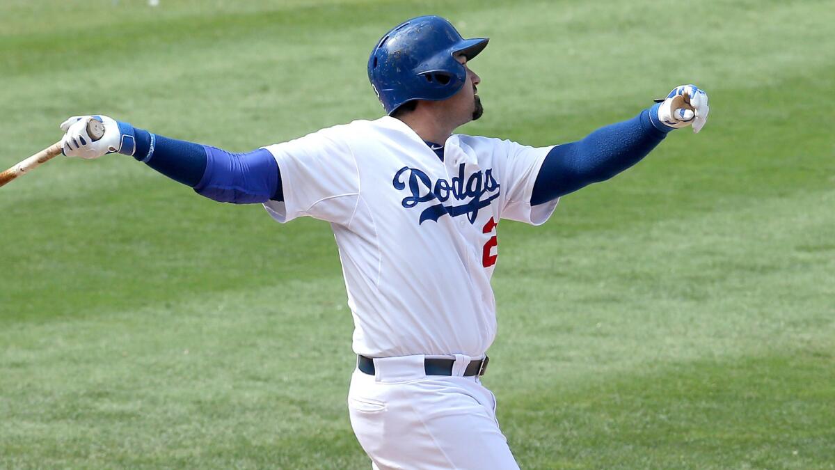 Dodgers first baseman Adrian Gonzalez hits a three-run home run in the sixth inning of a 7-2 win over the Arizona Diamondbacks on Sunday.
