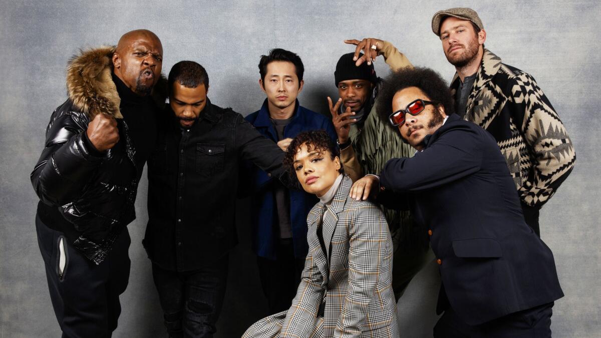 Actor Terry Crews from left, actor Omari Hardwick, actress Tessa Thompson, actor Steven Yeun, director Boots Riley, actor LaKeith Stanfield, and actor Armie Hammer from the film "Sorry to Bother You."