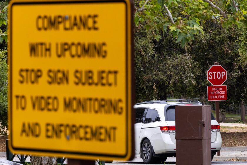 Pacific Palisades, CA May 15, 2024: Stop signs and warnings to not violate them or face a $100 fine in Temescal Gateway Park in the Santa Monica Mountains Wednesday May 15, 2024 in Pacific Palisades, CA. (Brian van der Brug/Los Angeles Times)