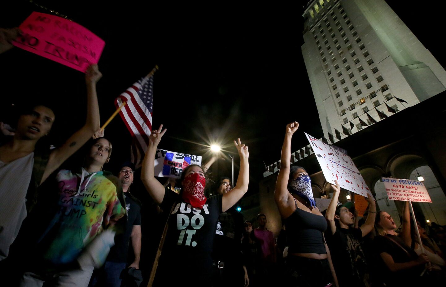 Protesters gather on the steps of L.A. City Hall before beginning their march through the streets of downtown on Friday night.