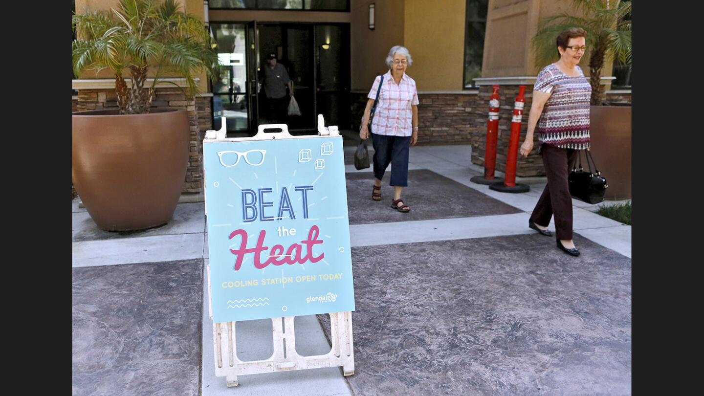 Yolanda Juarez, 77 of Eagle Rock, right, and Carmen Salinas, in her 80s and from Glendale, head out of the Adult Recreation Center on Colorado Blvd, after spending some time cooling off from the heatwave, in Glendale on Tuesday, Aug. 29, 2017.