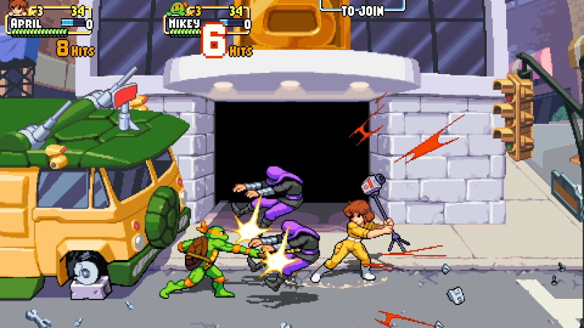 A woman holds a TV camera like a bat, ready to strike a villain, as Teenage Mutant Ninja Turtles fight in the street.