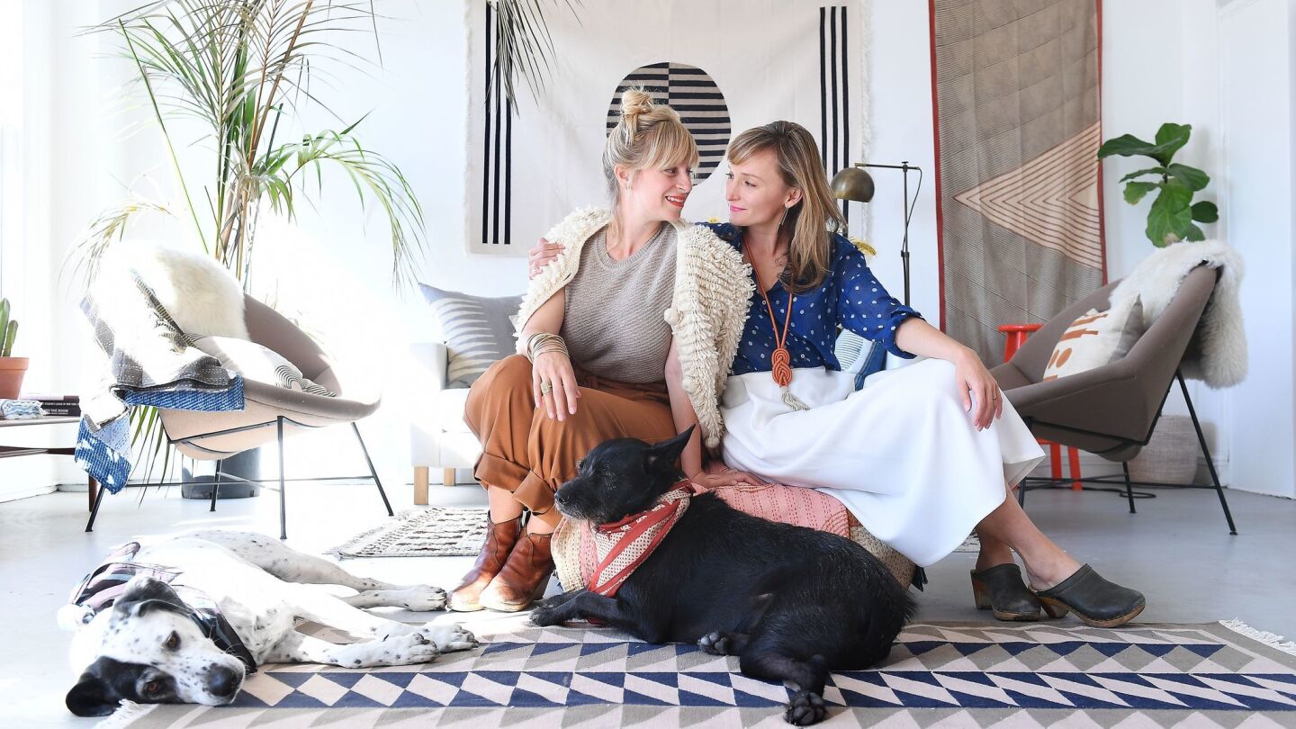 The sisters behind Block Shop textiles: Lily, left, and Hopie Stockman, with their dogs in their downtown Los Angeles studio.