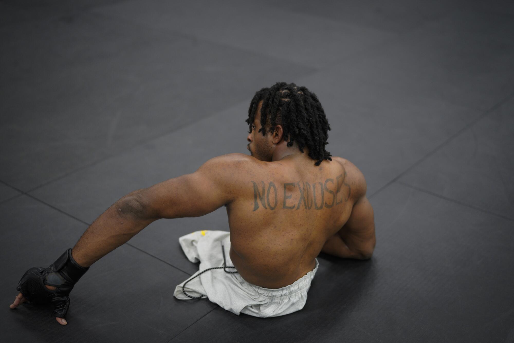 Zion Clark has the words "NO EXCUSES" tattooed on his back. It's part of his never-give-up philosophy on life.  