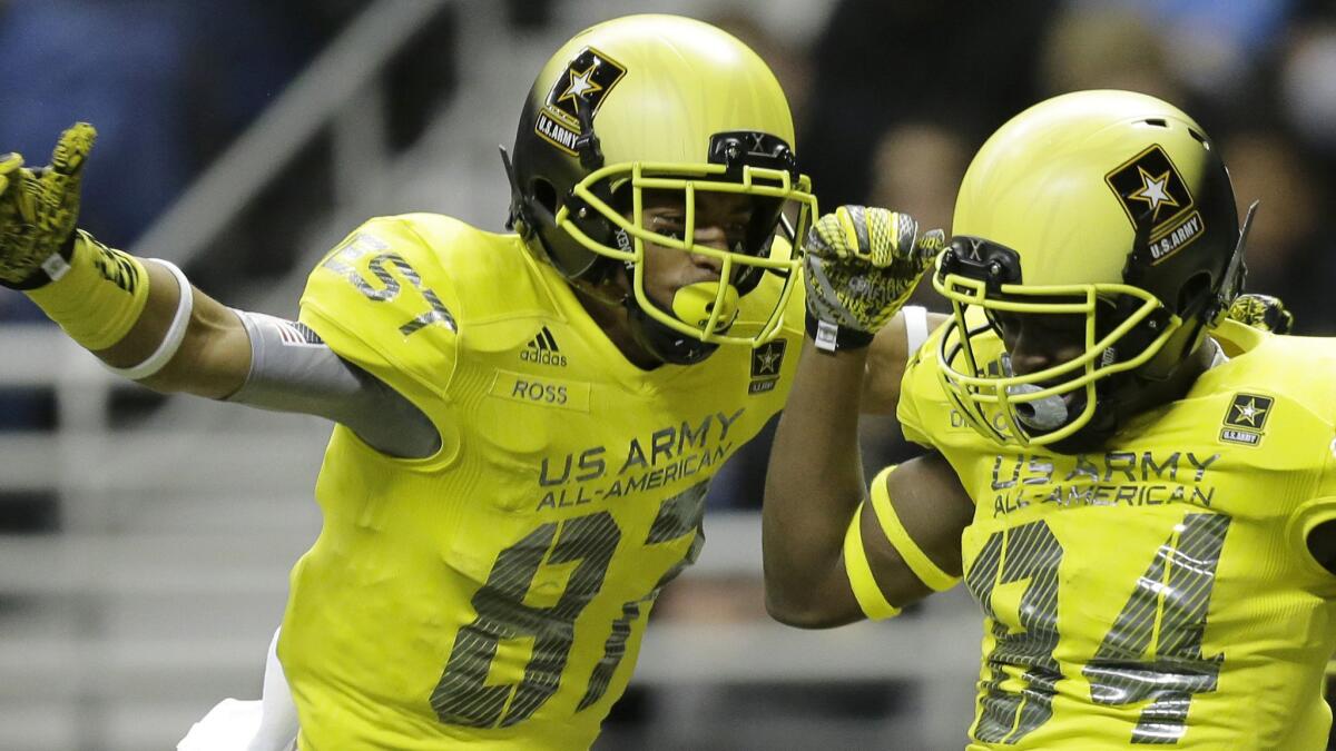 U.S. Army All-American West defensive back Ykili Ross, left, celebrates with Derrick Dillon after Dillon scored a touchdown during the U.S. Army All-American Bowl in San Antonio on Jan. 3.