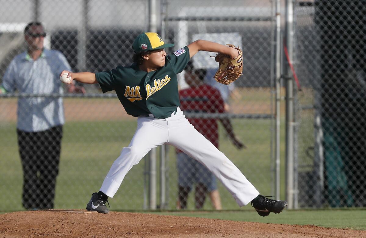 Costa Mesa American Little League's Isaiah Vasquez pitches against Ocean View in a District 62 Tournament of Champions Major Division quarterfinal game on Tuesday at Costa Mesa American Little League.
