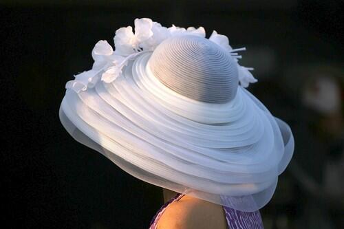 Kentucky Derby A model wears a hat during the morning training for the Kentucky Derby on Wednesday. The race takes place Saturday at Churchill Downs in Louisville, Ky.