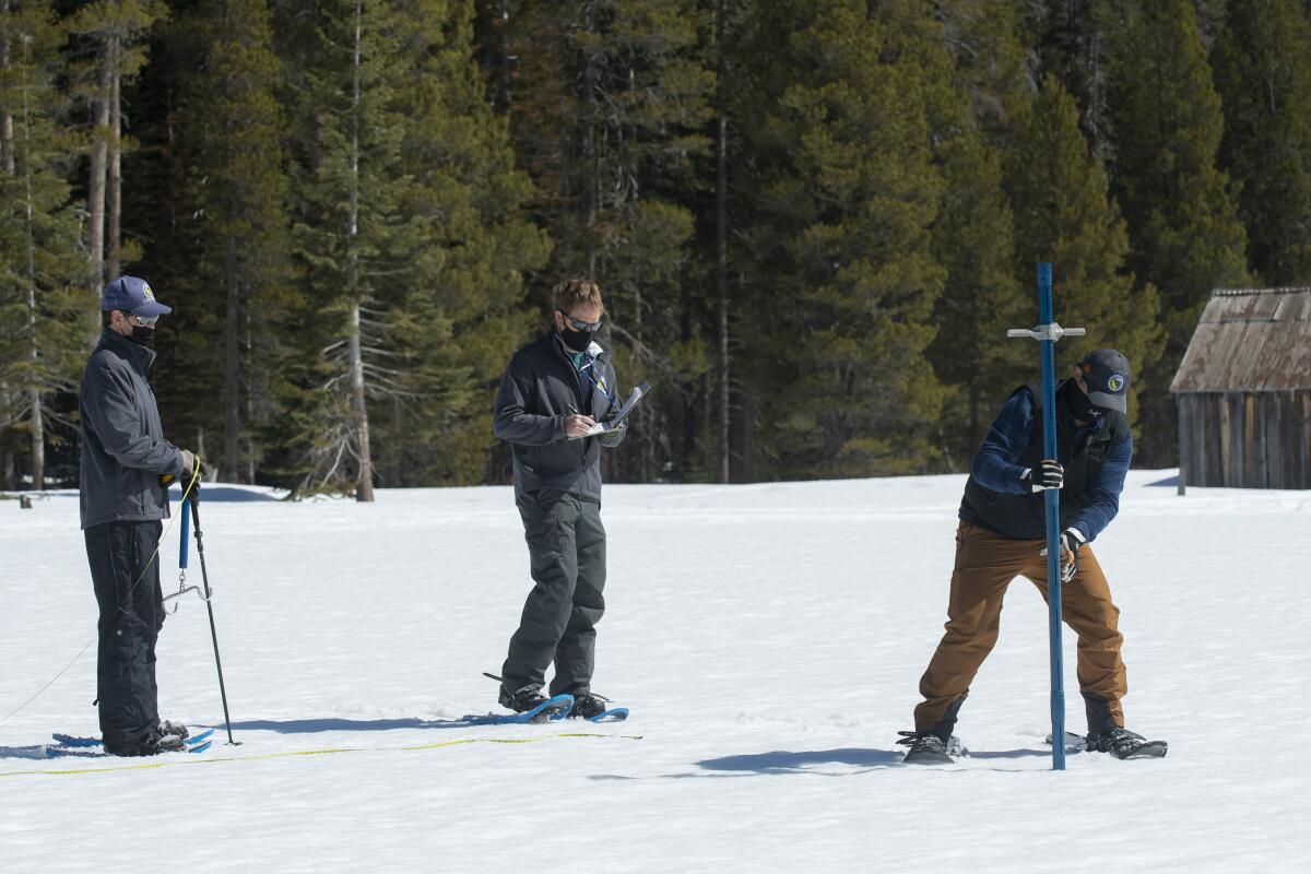 State workers measure snow levels