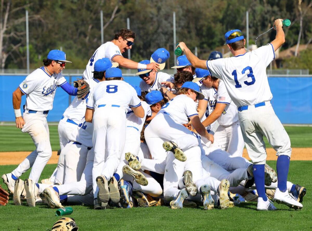 Santa Margarita High baseball players celebrate their 3-2 win over La Costa Canyon in the Division I regional final.